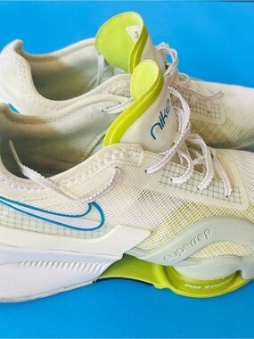 Nike White Training Sneakers with Blue Swoosh and Neon Yellow Accents
